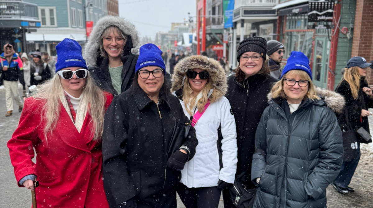 Six librarians who were featured in the documentary film "The Librarians" posing outside at the Sundance Film Festival.